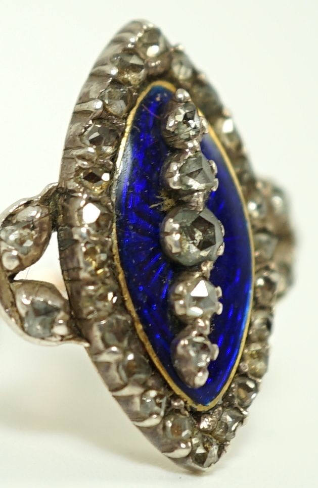 An 19th century gold, rose cut diamond and blue guilloche enamel set marquise shaped ring
